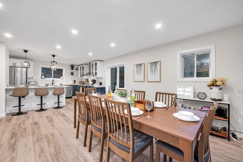 8 seat family table for large gatherings with additional seating at island.