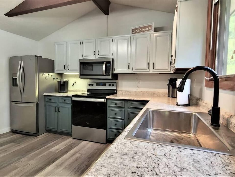 Stainless steel fridge with ice/water, range, microwave, and dishwasher. Keurig also available!