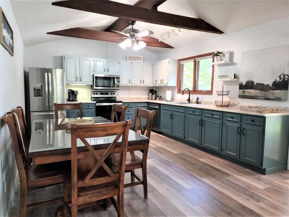 Kitchen and dining area with seating for six.