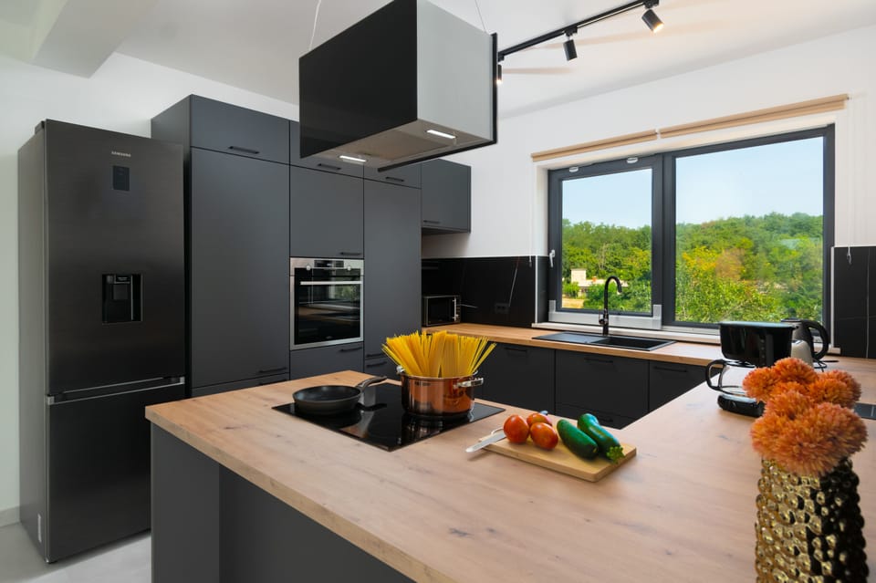 Fully equipped kitchen with all necessary appliances for making favorite dishes.