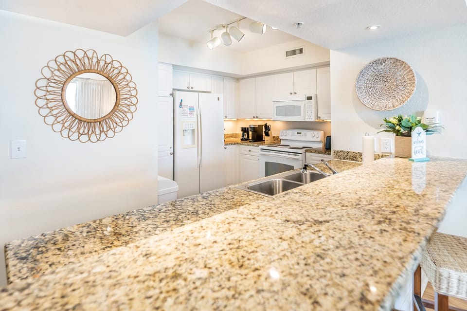 Fully-stocked kitchen. Bar seating plus kitchen table w/ 4 chairs.