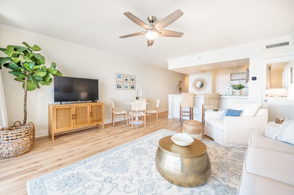 Spacious living room with queen sleeper sofa, 50" smart TV, & view of gulf!