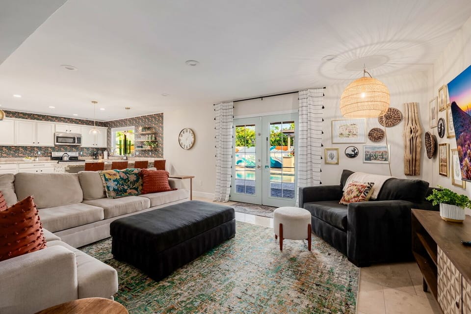 The open concept living area is just off the kitchen, has a SmartTV