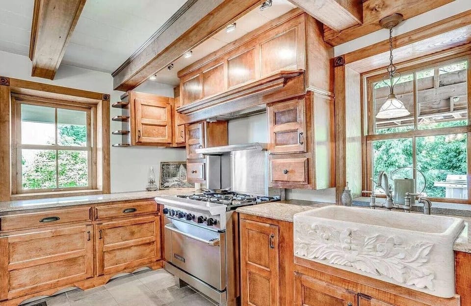 Commercial range, farmhouse sink, microwave, fridge and freezer