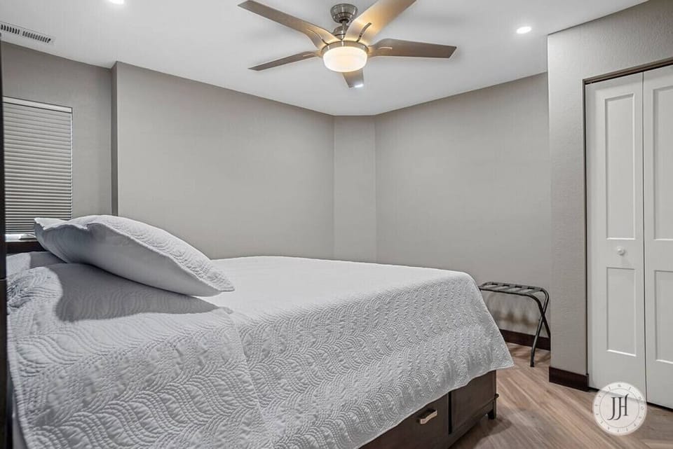 Relax in our master bedroom featuring a luxurious king-size bed with premium sheets for the ultimate comfort.