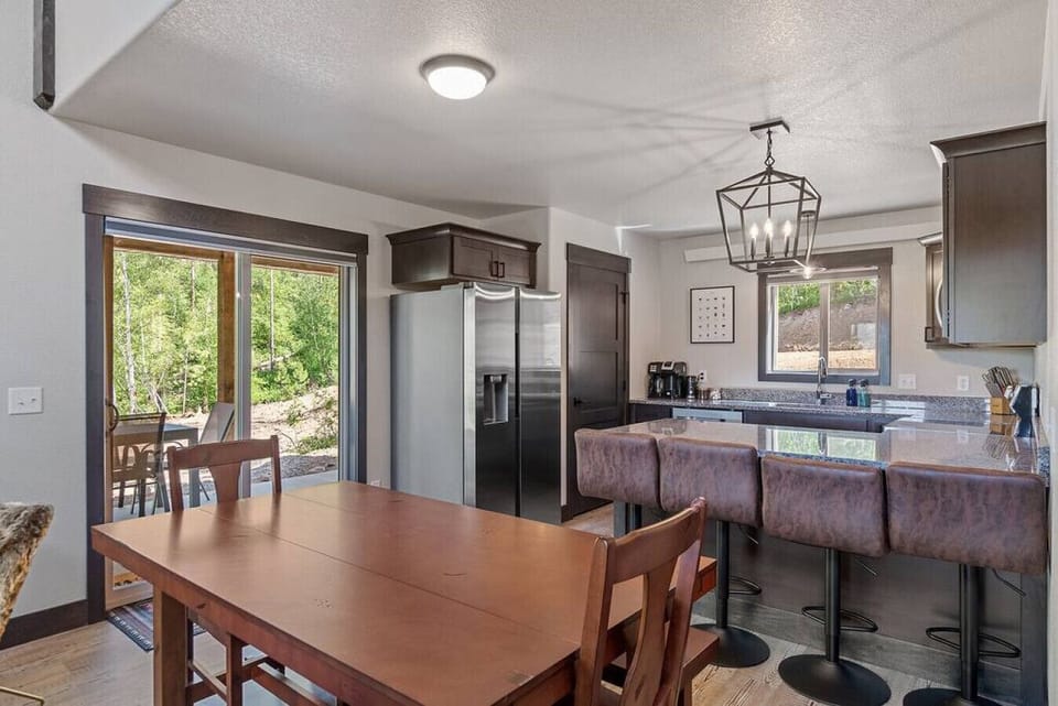6-person dining table attached with a bar for 4-person additional seating