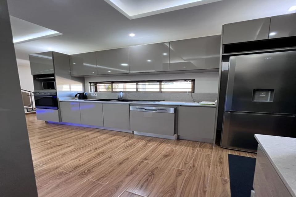 Double basin sink, fridge & freezer, dishwasher, oven, microwave.