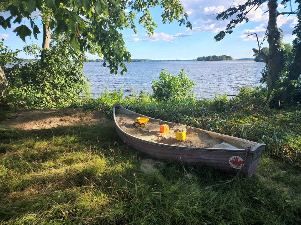 sand box in the rowboat, facing the west shore.  