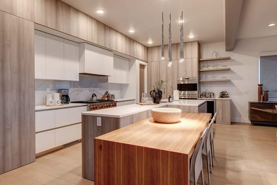 Gourmet chef's kitchen with Wolf, Sub-Zero appliances, breakfast bar seating for 4