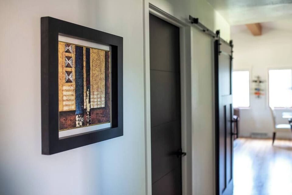 Hallway art towards dining and living area.