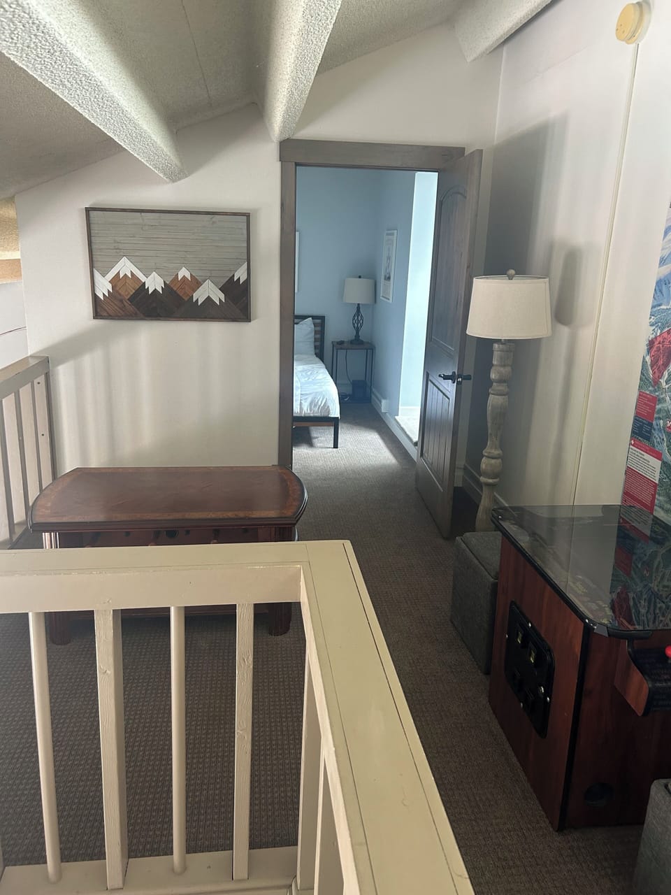 Loft area with entry to 3rd bedroom with queen, dresser and pull-out twin.   