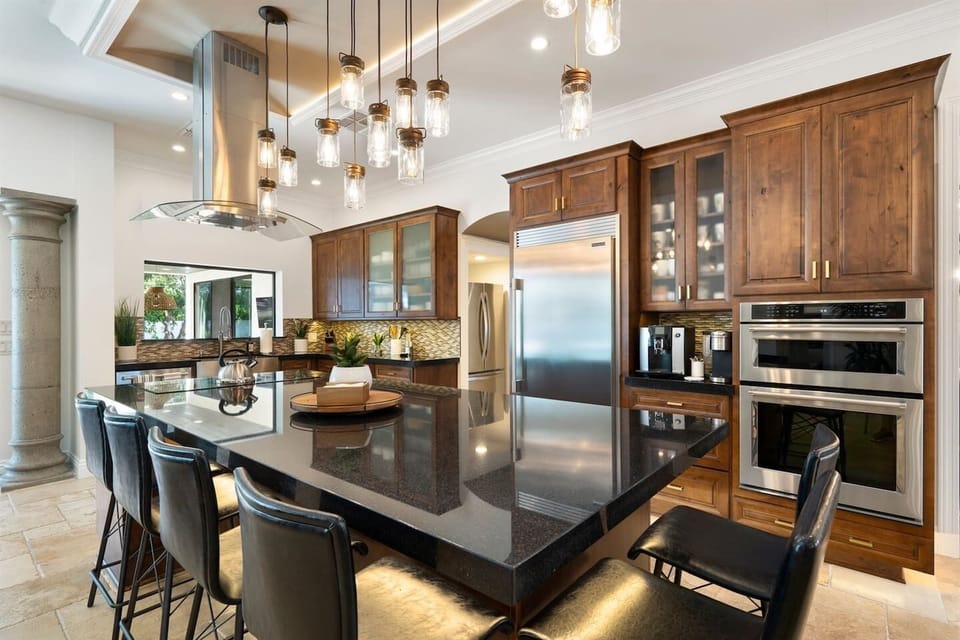 Where culinary dreams come true! Our spacious kitchen and dining area are illuminated by stunning ceiling lights, complemented by a large fridge for your convenience. Enjoy home-cooked meals in style!