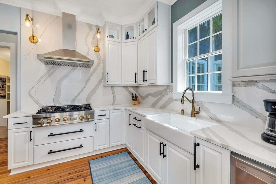 Close-up of kitchen stovetop and granite countertops