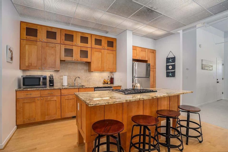 Spacious Kitchen Island with Built-In Stovetop, Perfect for Cooking and Entertaining