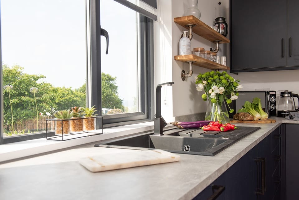Bright and airy kitchen with large window - Bay Dream
