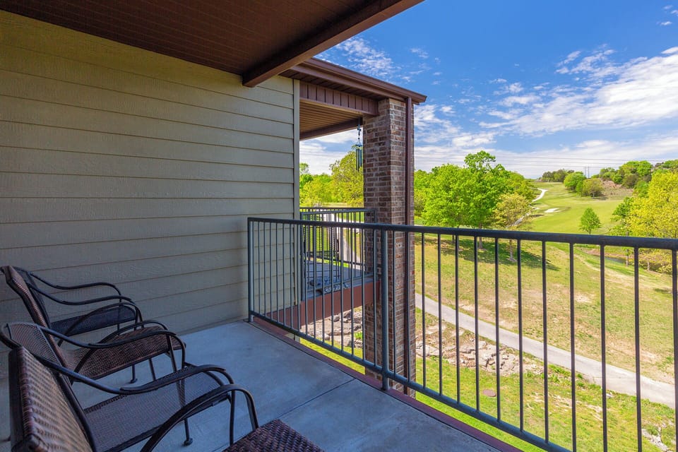 Comfy outdoor patio with view of golf course.