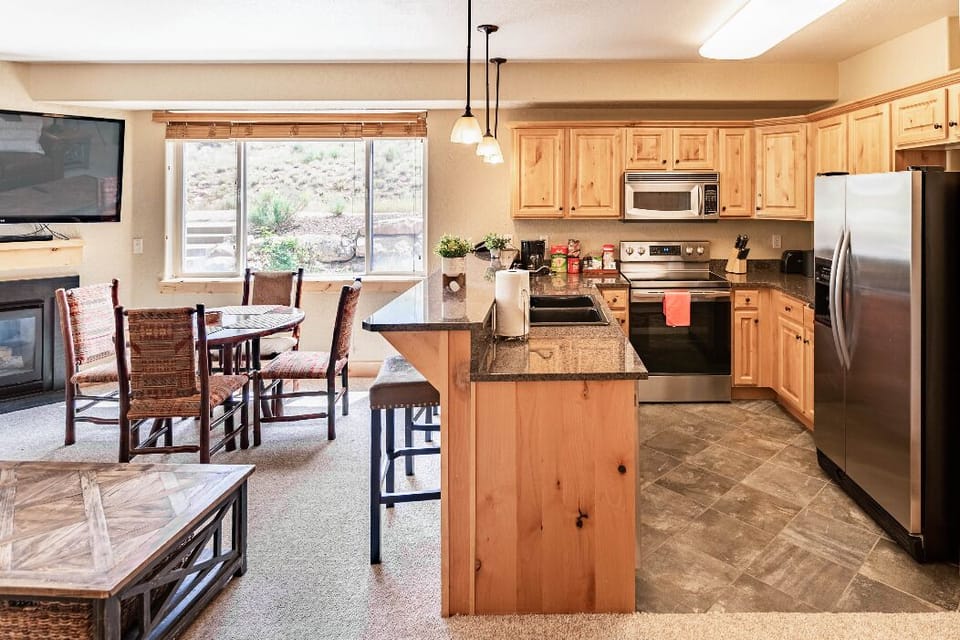 When it's time to eat, gather around the four-person dining table.