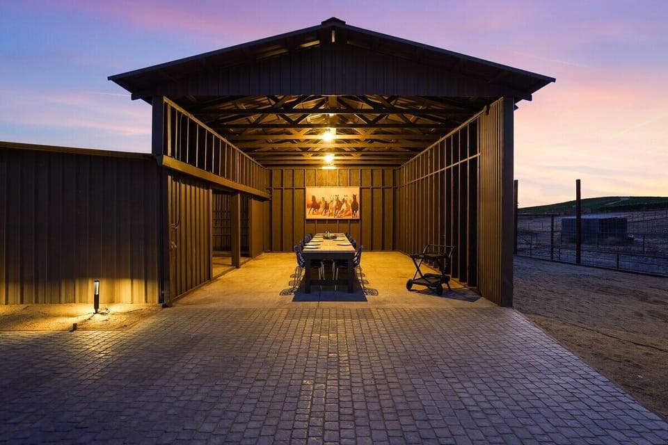 Long outdoor  dining table under shed 