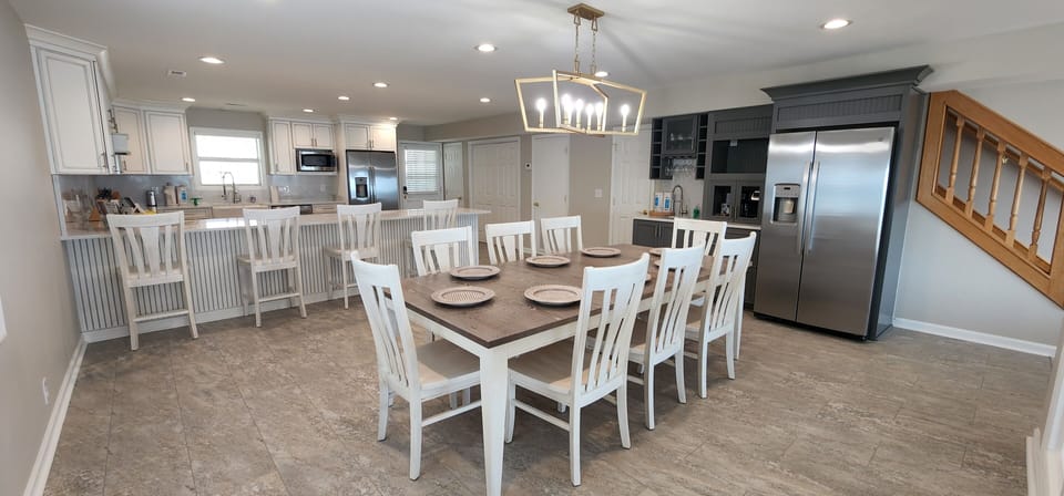Enjoy a welcome set of starter amenities, including K cups, two rolls of paper towels, trash bags, laundry and dishwasher pods, hand soap, dish soap, kitchen cleaning wipes, and a sponge.
