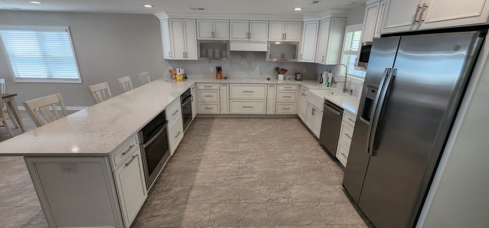 Enjoy a welcome set of starter amenities, including K cups, two rolls of paper towels, trash bags, laundry and dishwasher pods, hand soap, dish soap, kitchen cleaning wipes, and a sponge.