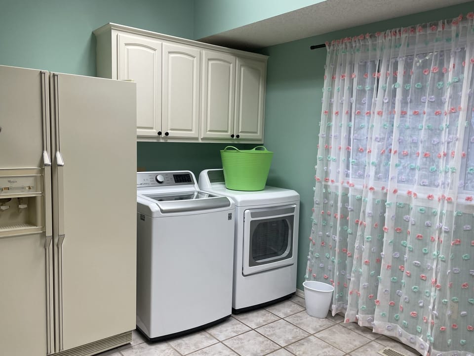 Main floor laundry with 2nd refrigerator. 3rd fridge in the pool house.