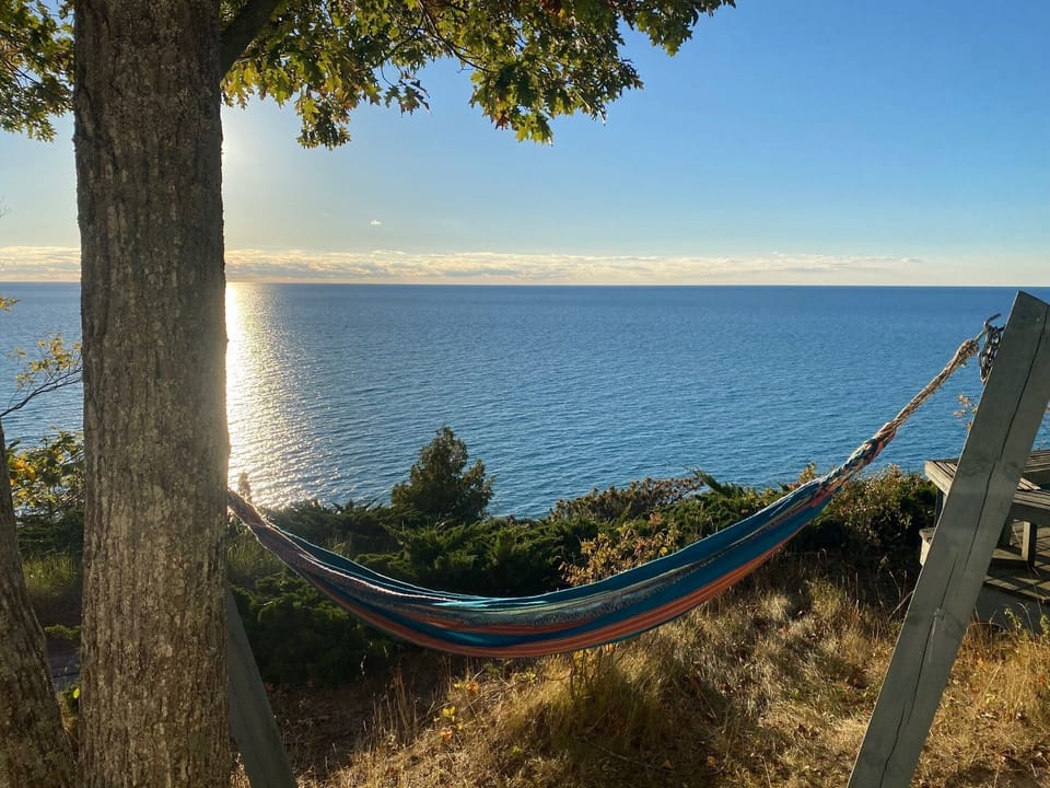 EXTERIOR:  The relaxing hammock in front of the deck and overlooking Lake Michigan