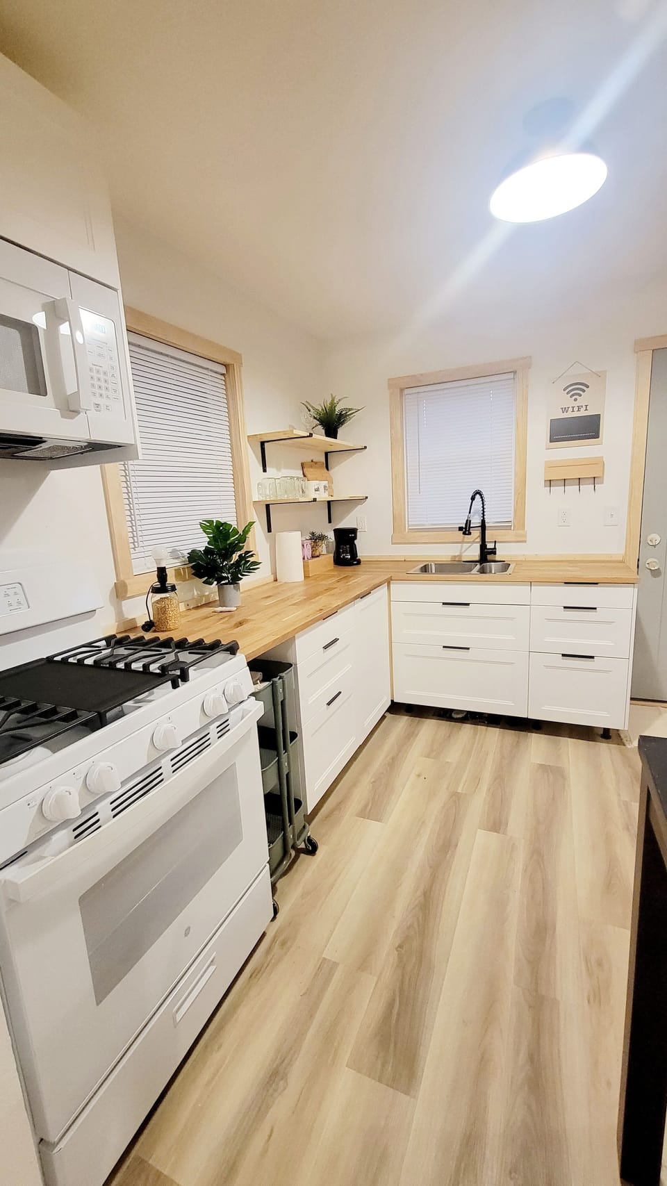 Newly renovated kitchen with gas stove.