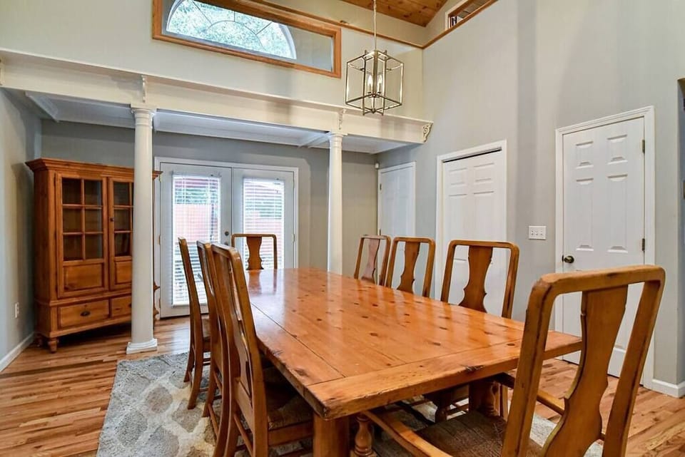 Large dining room table with seating for 8