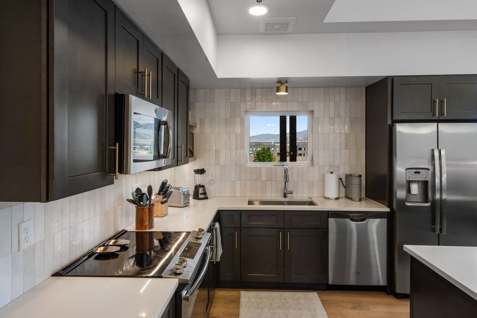 Full kitchen with Keurig coffee maker available for use.