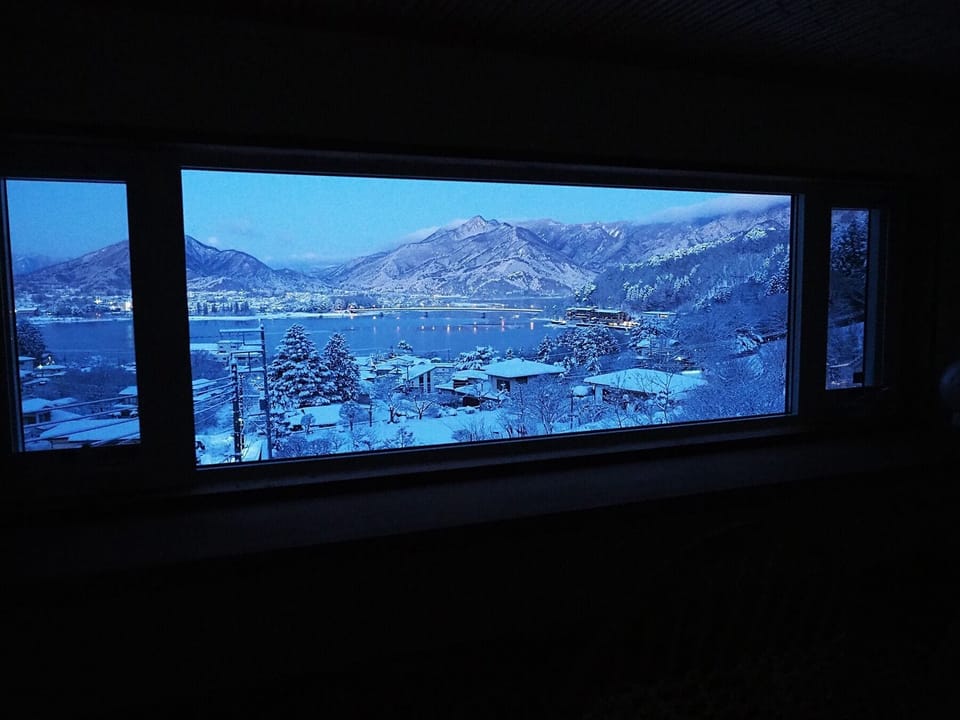 View of the snowy landscape at dawn from the loft.