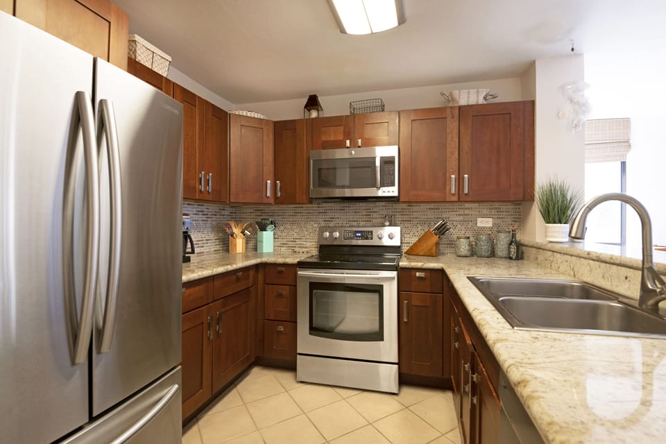 Modern kitchen with top-of-the-line appliances and full cookware — everything you need to prepare meals while staying in paradise.