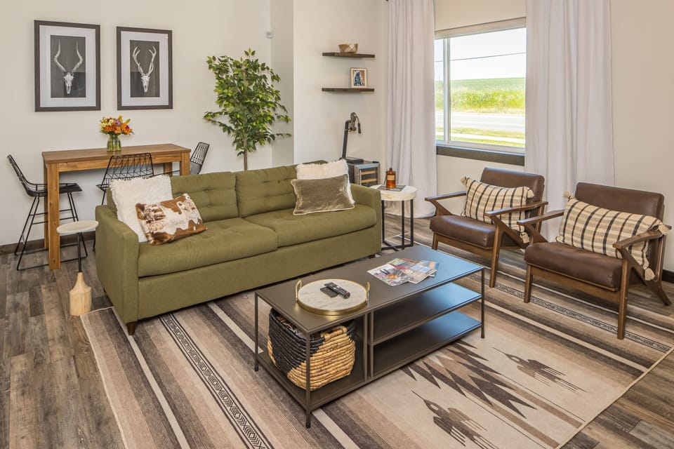 The green couch pulls out into a full sized bed.