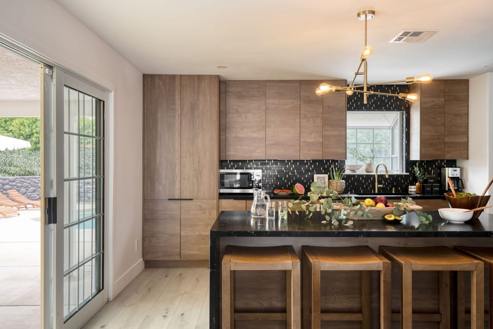 Modern kitchen with barstool seating at the island.