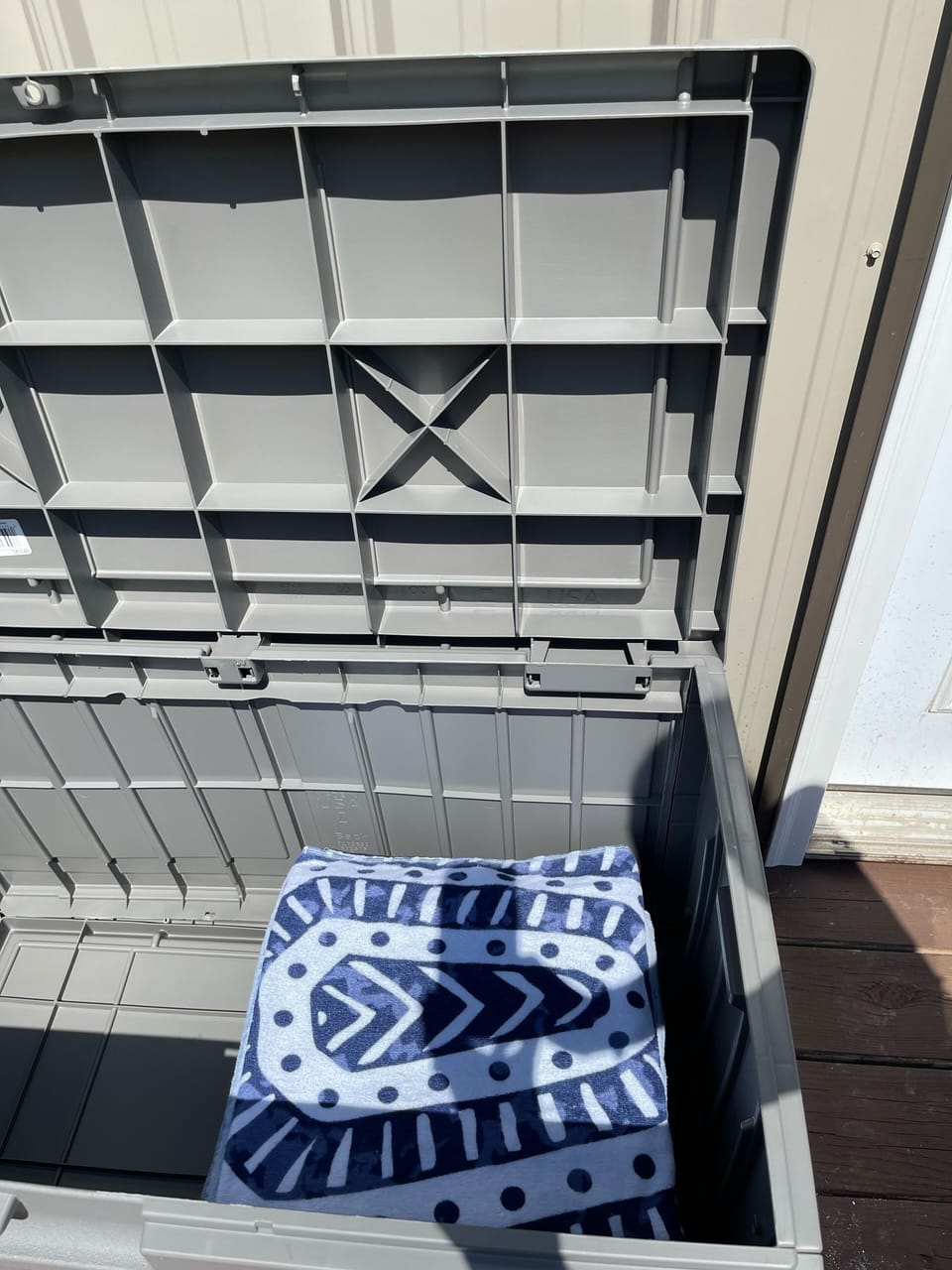 Pool towels on deck in bin. 