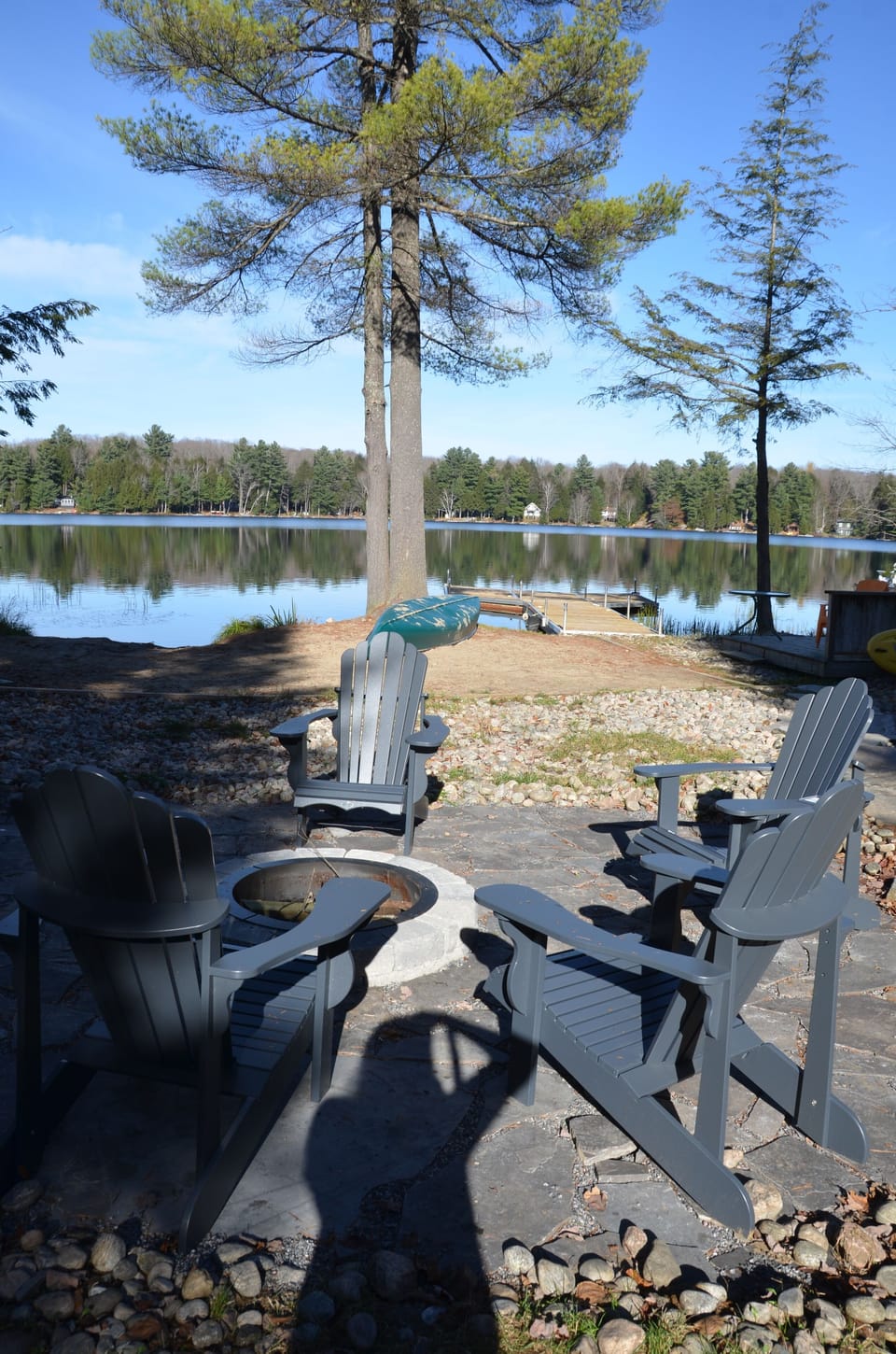 flagstone fire pit with muskoka chairs