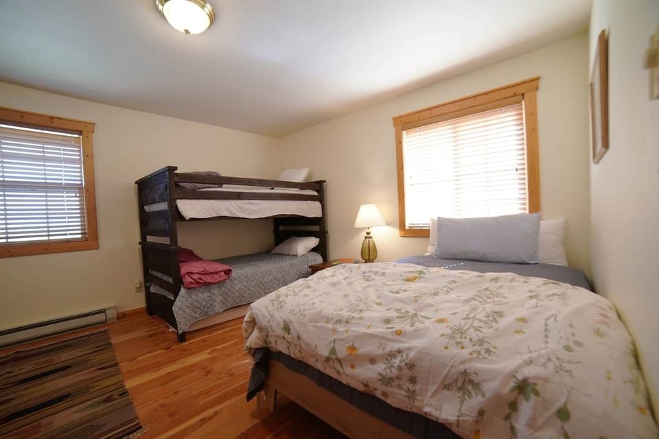 Bedroom #2 features a full bed and a twin-over-twin bunk.