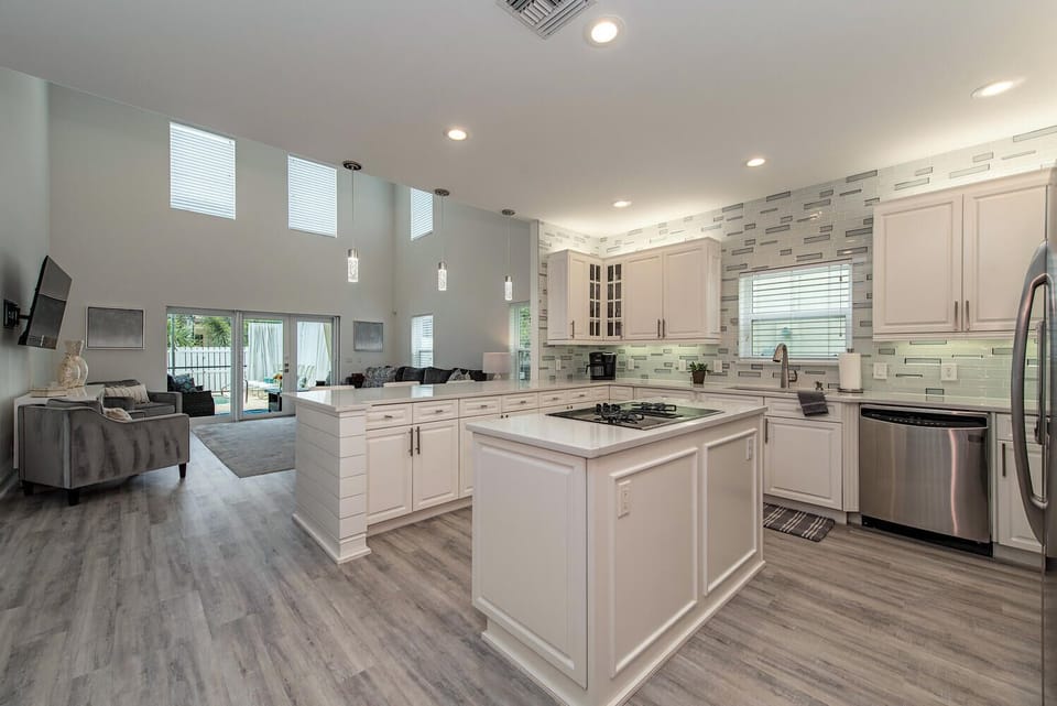 A bright, equipped kitchen with ample counter space and modern appliances — ideal for morning coffee, vacation meals, and happy-hour snacks