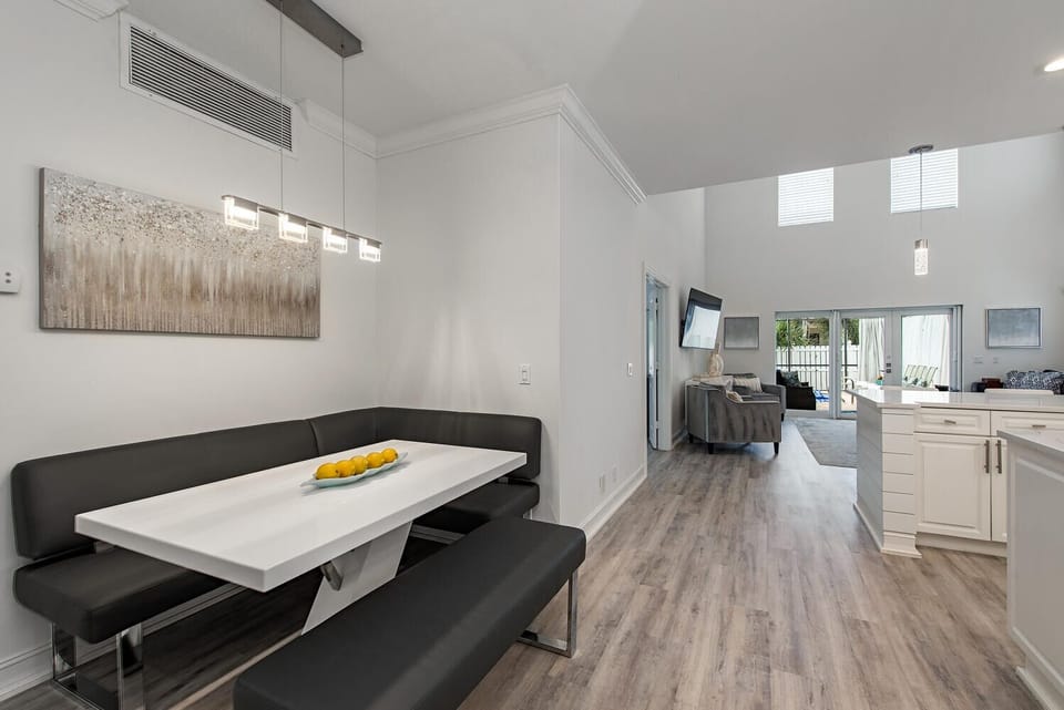 Enjoy shared meals and family moments at the spacious dining table, just steps from the kitchen and overlooking the main living space