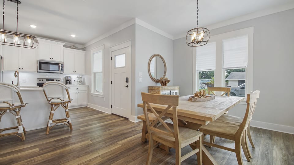 Dining and Kitchen features new appliances and coastal 30A style furniture.