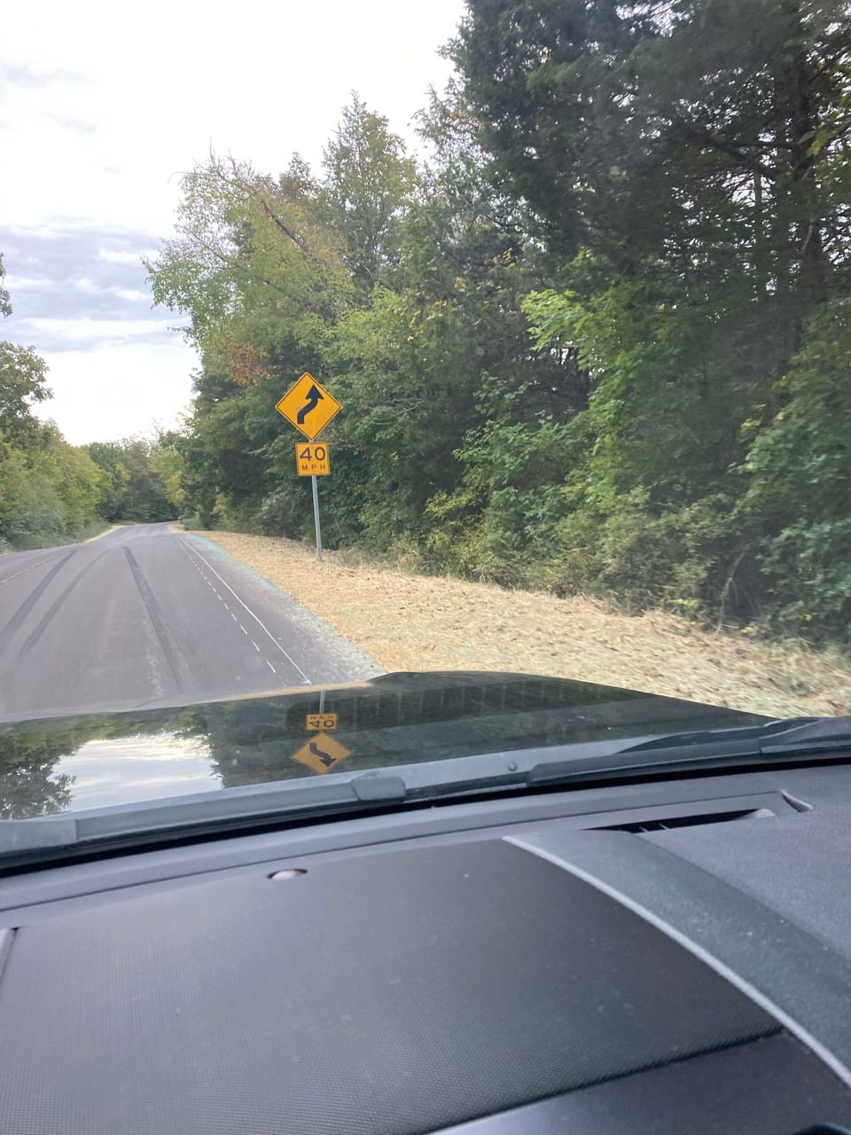 Turn left after curvy road sign.  White House on right .  1/4 mile (next right.)