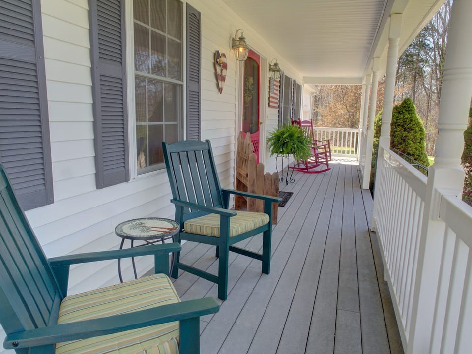 Peaceful covered porch for enjoying your coffee or wine!