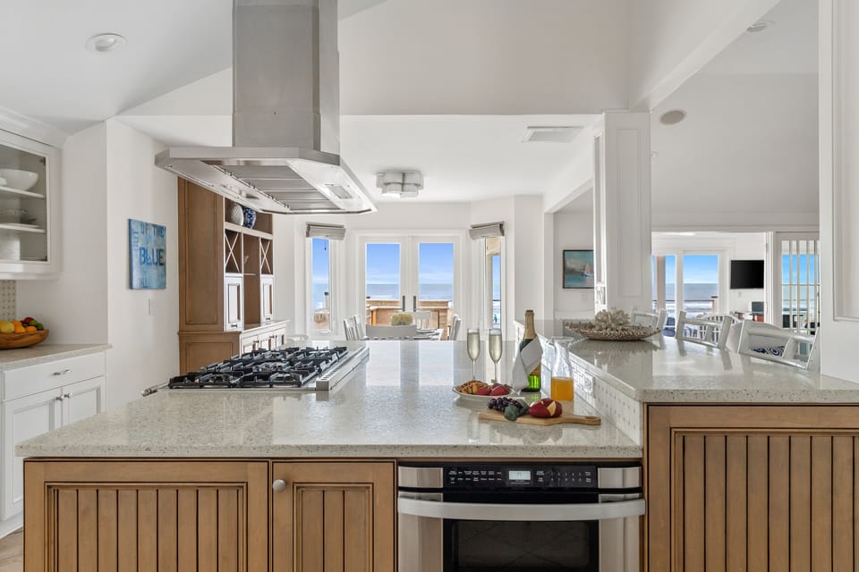 Kitchen with professional range and stainless appliances.