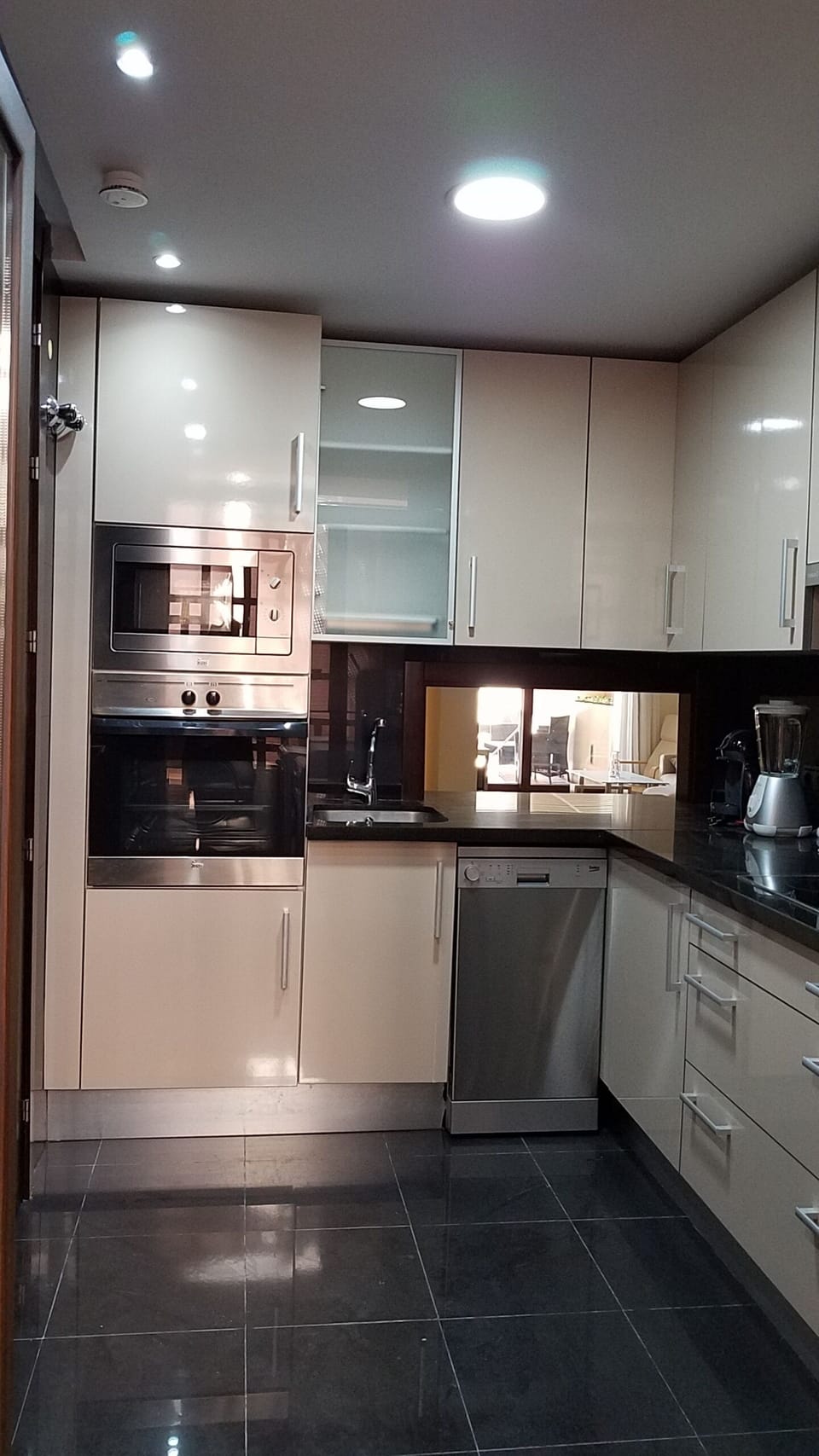 Kitchen with an opening/bar into the dining room. Oven nad Microwave