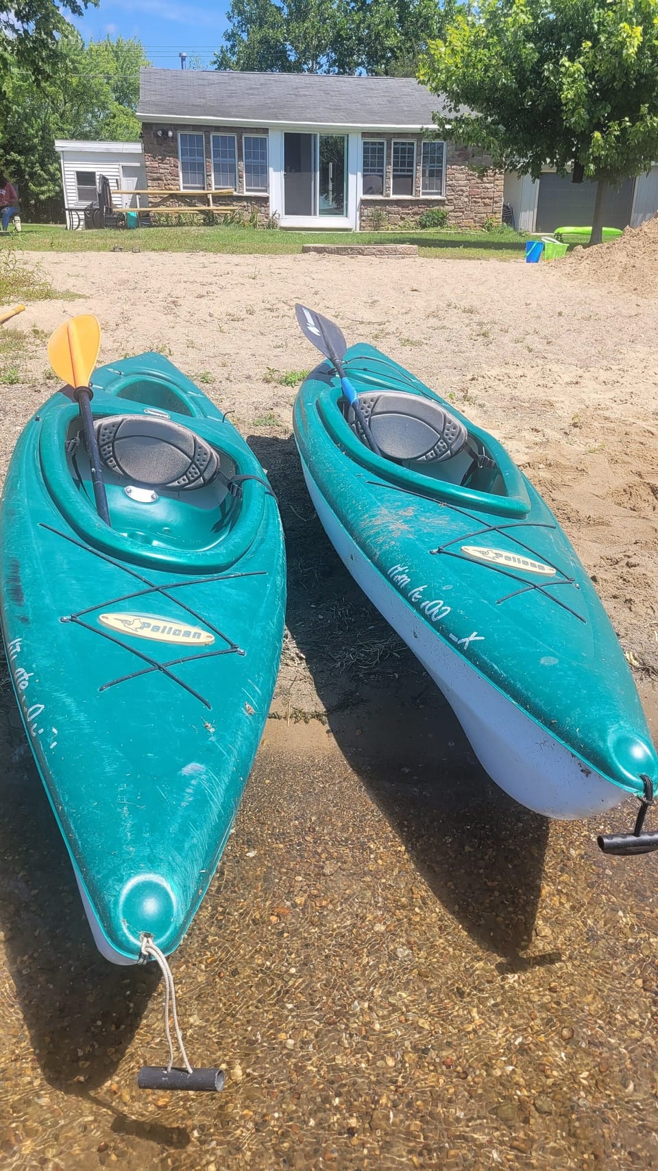 2 10' Pelican kayaks with paddles to use on 220 acre lake to the Huron River.