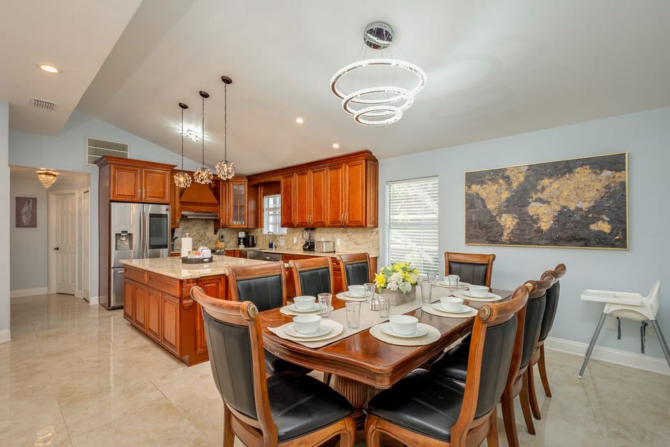 The luxurious dining room is located just off the kitchen, with space for 8. 