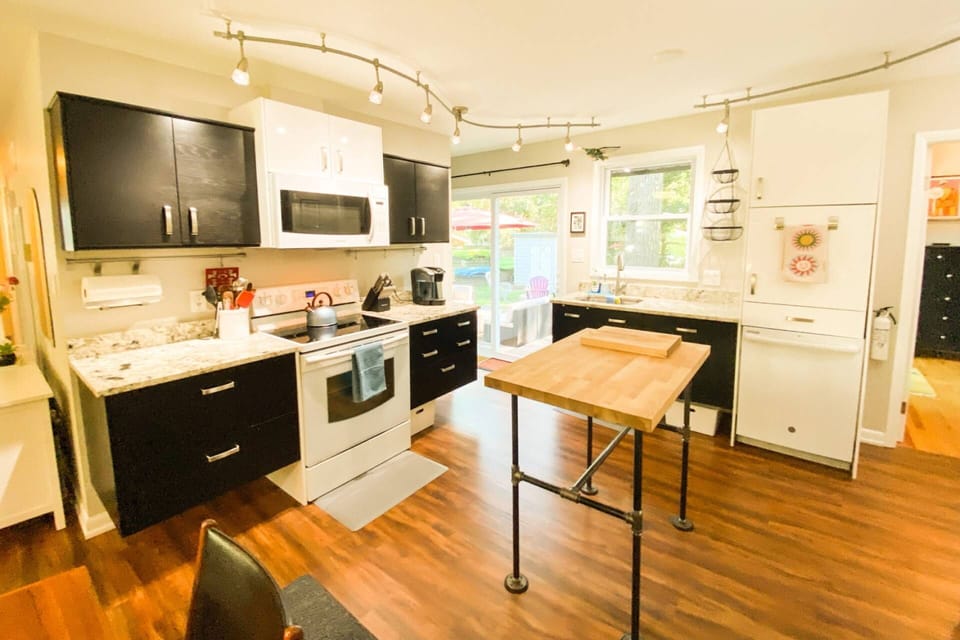 The contemporary kitchen is fully stocked for your stay.