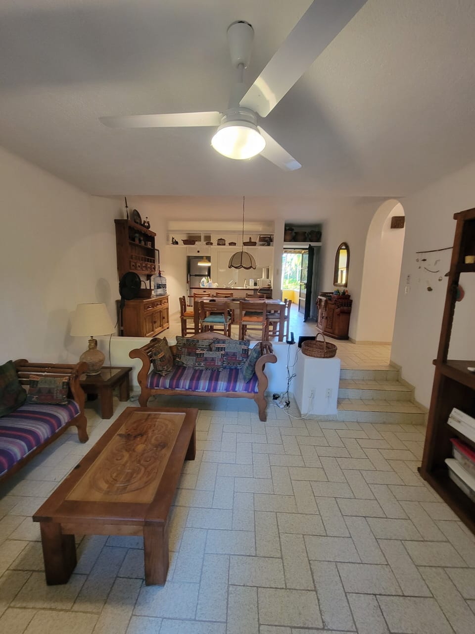 Living room, kitchen and front door from deck doors