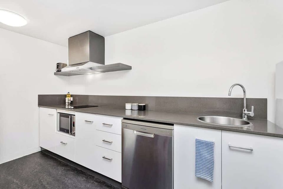 Kitchen - Crockery & cutlery provided along with basic kitchen amenities.
