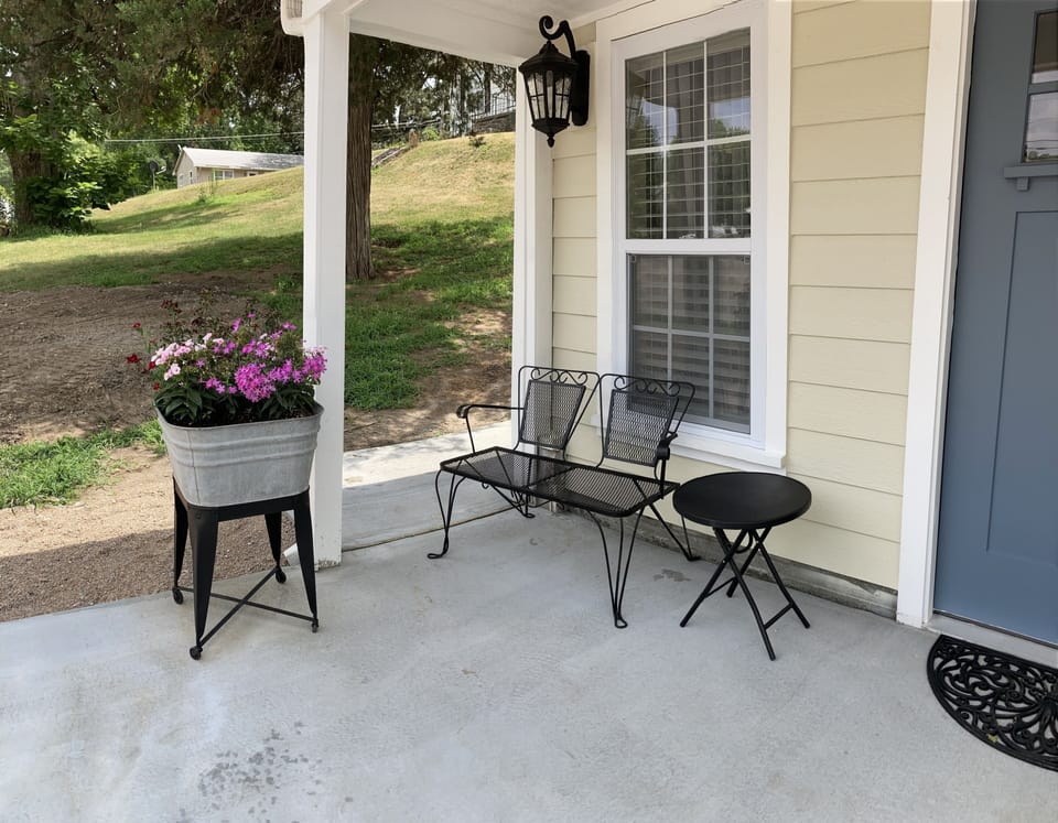 Sit and relax on the darling front porch.
