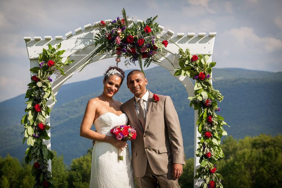 Wedding arbor and wedding elpoement couple
